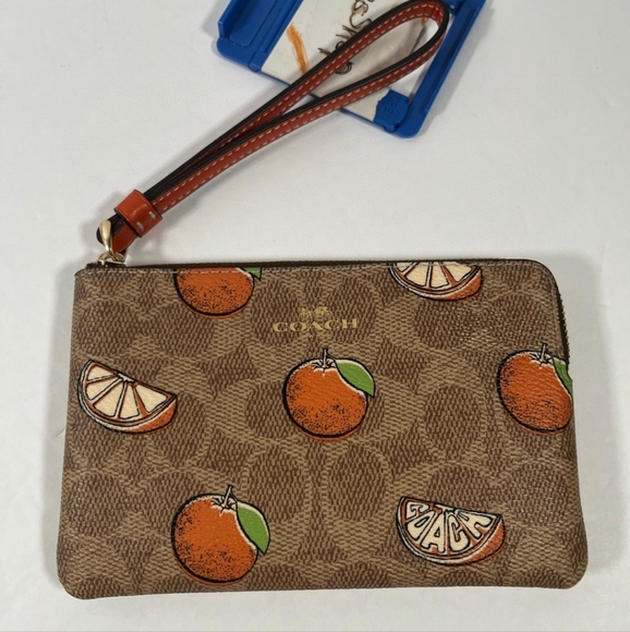 NWT Coach Corner Zip Wristlet In Signature Canvas With Orange Print - Picture 1 of 3